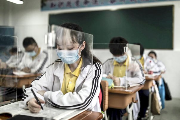 WUHAN, CHINA - MAY 06: (CHINA OUT) Senior students study in a classroom with transparent boards placed on each desk to separate each other as a precautionary measure against the spead of COVID-19 at Wuhan No. 23 Middle School on May 6, 2020 in Wuhan, Hubei Province, China .About 57,800 students in their final year from 121 high and vocational schools returned to campus on Wednesday in Wuhan, The city previously hard hit by the COVID-19 outbreak.(Photo by Getty Images)