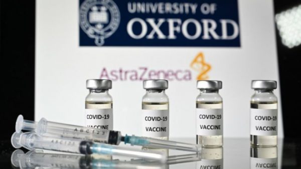 (FILES) In this file photo taken on November 17, 2020 An illustration picture shows vials with Covid-19 Vaccine stickers attached and syringes, with the logo of the University of Oxford and its partner British pharmaceutical company AstraZeneca. - The University of Oxford and drug manufacturer AstraZeneca have applied to the UK health regulator for permission to roll out their Covid-19 vaccine, Health Minister Matt Hancock said on December 23, 2020. "I'm delighted to be able to tell you that the Oxford AstraZeneca vaccine developed here in the UK has submitted its full data package to the MHRA for approval," he said. (Photo by JUSTIN TALLIS / AFP)